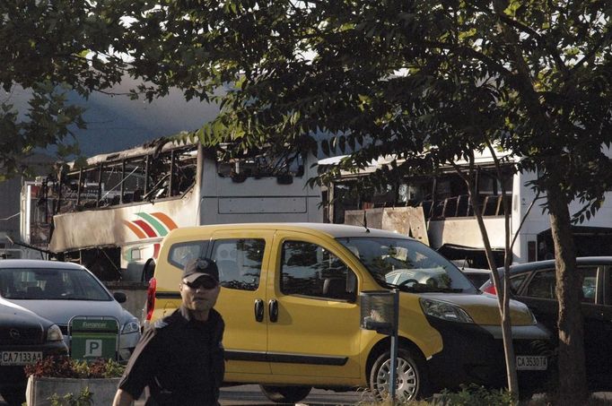 Burnt buses are seen at Bulgaria's Burgas airport July 18, 2012. Three people were killed and over 20 injured by an explosion on a bus carrying Israeli tourists outside the airport of the Black Sea city of Burgas on Wednesday. The mayor of the city, on Bulgaria's Black Sea coast, said the bus was carrying Israeli tourists, but the police could not immediately confirm the nationality of the tourists. Police said several other buses at the site had been damaged. REUTERS/Stringer (BULGARIA - Tags: DISASTER)