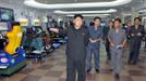 North Korea's leader Kim Jong-un visits a newly built video games room at the amusement house of the Rungna People's Pleasure Park