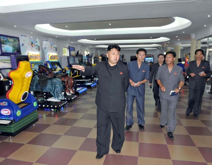 North Korea's leader Kim Jong-un visits a newly built video games room at the amusement house of the Rungna People's Pleasure Park