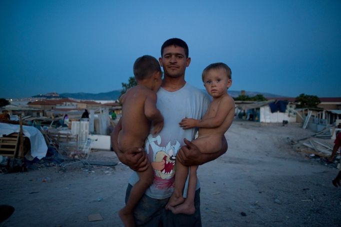 24 Titulek: Gypsy slums of Greece Popis: September 16, 2011, Tavros, Athens/Attica, Greece: Almost 30,000 Gypsies or "Roma" from Albania and Bulgaria enter Greece in the last two years. Since 1998, one thousand Roma have lived in a slum in the Votanicos area, of the Tavros municipality of Athens. Their 600 children aged from infants to 15 years old, live under unhealthy conditions in the garbage strewn township where the Roma survive by stealing or collecting metal garbage to sell. The Roma burn cables to extract the copper inside, which creates a toxic cloud from cancerous dioxines that hangs over their shantytown. While shantytowns are less common in Europe, the growing influx of illegal immigrants have fueled shantytowns in cities commonly used as a points of entry into the EU, including Athens. In October 2013, an unidentified girl, called "Maria," was found in a Greek gypsy camp and could be related to missing child cases. Over 8,000 calls about the girl from all over the world including the U.S. and Canada have been received inquiring about the child. The blond girl, approximately age 4, was found in a Roma gypsy settlement in central Greece. DNA tests proved that she was not related to the 39-year-old man and 40-year-old woman who claimed to be her parents.