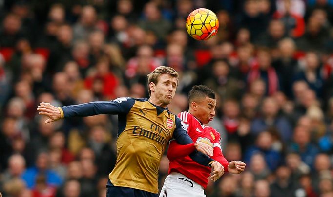 Arsenal's Nacho Monreal in action with Manchester United's Jesse Lingard