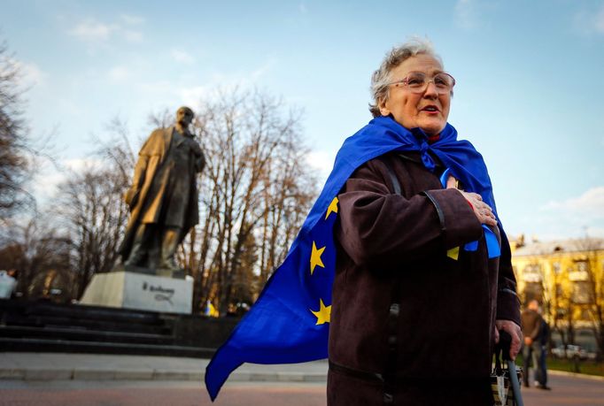 A woman wrapped with European Union flag speaks during a pro-Ukrainian rally in Luhansk, eastern Ukraine April 15, 2014.