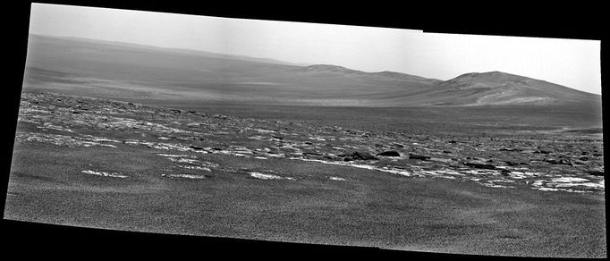 Opportunity's View Approaching Rim of Endeavour NASA's Mars Exploration Rover Opportunity used its panoramic camera (Pancam) to capture this view of a portion of Endeavour crater's rim after a drive during the rover's 2,676th Martian day, or sol, of working on Mars (Aug. 4, 2011). The drive covered 396 feet (120.7 meters) and put the rover with about that much distance to go before reaching the chosen arrival site at the rim, called "Spirit Point." Endeavour crater has been the rover team's destination for Opportunity since the rover finished exploring Victoria crater in August 2008. Endeavour, with a diameter of about 14 miles (22 kilometers), offers access to older geological deposits than any Opportunity has seen before. This view looks toward a portion of the rim south of Spirit Point, including terrain that Opportunity may explore in the future. Image Credit: NASA/JPL-Caltech/Cornell/ASU