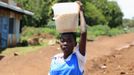 A student from Barack Obama Primary School carries maize on her head as she walks from school in Kogelo village, the ancestral home of U.S. President Barack Obama in Nyangoma Kogelo shopping centre, 430 km (367 miles) west of Kenya's capital Nairobi November 5, 2012. Four years ago, Kogelo, and Africa in general, celebrated with noisy gusto when Obama, whose father came from the scattered hamlet of tin-roofed homes, became the first African-American to be elected president of the United States. Looking across the Atlantic to the Nov. 6 presidential election, the continent is cooler now towards the "son of Africa" who is seeking a second term. There are questions too whether his Republican rival, Mitt Romney, will have more to offer to sub-Saharan Africa if he wins the White House. To match Analysis AFRICA-USA/ELECTION REUTERS/Thomas Mukoya (KENYA - Tags: SOCIETY ELECTIONS POLITICS USA PRESIDENTIAL ELECTION) Published: Lis. 5, 2012, 2:46 odp.