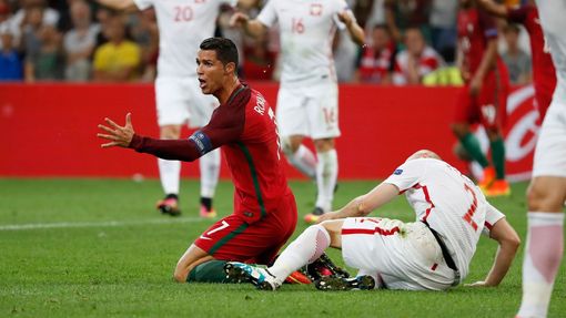 Portugal's Cristiano Ronaldo reacts after a challenge from Poland's Michal Pazdan