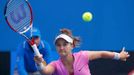 Lauren Davis of the United States hits a return to Julia Goerges of Germany during their women's singles match at the Australian Open 2014 tennis tournament in Melbourne