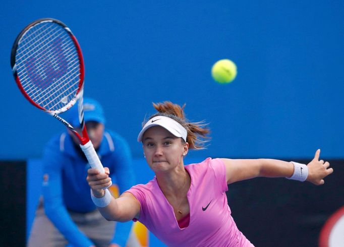 Lauren Davis of the United States hits a return to Julia Goerges of Germany during their women's singles match at the Australian Open 2014 tennis tournament in Melbourne