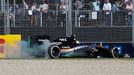 Force India Formula One driver Sergio Perez of Mexico drives into the gravel after being clipped by McLaren Formula One driver Jenson Button of Britain during the Austral