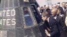 Former United States President John F. Kennedy and astronaut Lieutenant Colonel John Glenn, Jr. (2NDL) look inside the space capsule Friendship 7 following the presentation ceremony of the National Aeronautics and Space Administration (NASA) Distinguished Service Medal to Glenn in Cape Canaveral, Florida, in this handout image taken on February 23, 1962. The Friendship 7 carried Glenn in orbit around the earth three times