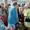 Britain's Queen Elizabeth greets women in their nineties as she walks through Windsor on her 90th Birthday, in Windsor