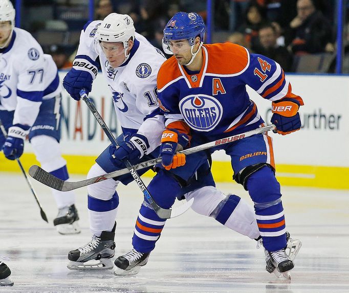 Edmonton Oilers forward Jordan Eberle (14) and Tampa Bay Lightning forward Ondrej Palat (18)