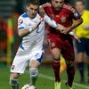 Alba of Spain is challenged by Pekarik of Slovakia during their Euro 2016 qualification soccer match at the MSK stadium in Zilina