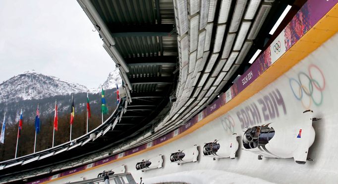 Pilot Jan Vrba (front) of the Czech Republic and his teammates speed down the track during a four-man bobsleigh training session at the Sanki Sliding Center in Rosa Khuto