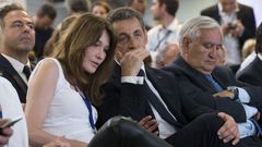 Nicolas Sarkozy, former French president and head of the newly renamed &quot;The Republicans&quot; political party, and his wife Carla Bruni-Sarkozy attend a rally in Paris