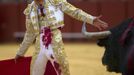 Spanish matador Antonio Nazare prepares to perform a pass to a bull during a bullfight in Seville