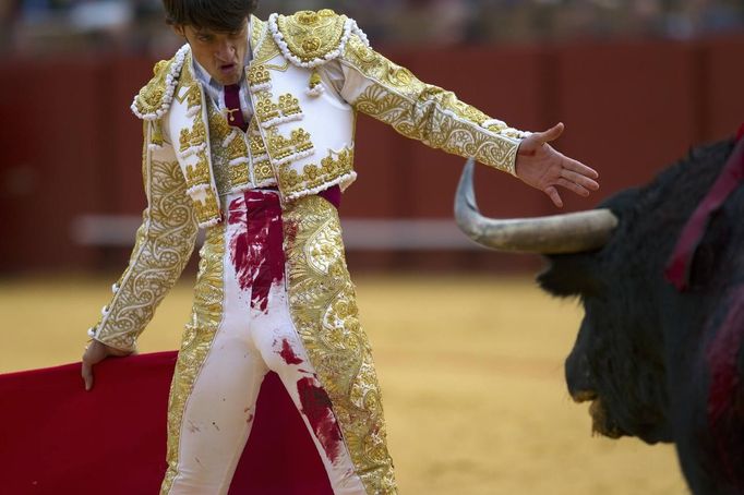 Spanish matador Antonio Nazare prepares to perform a pass to a bull during a bullfight in Seville