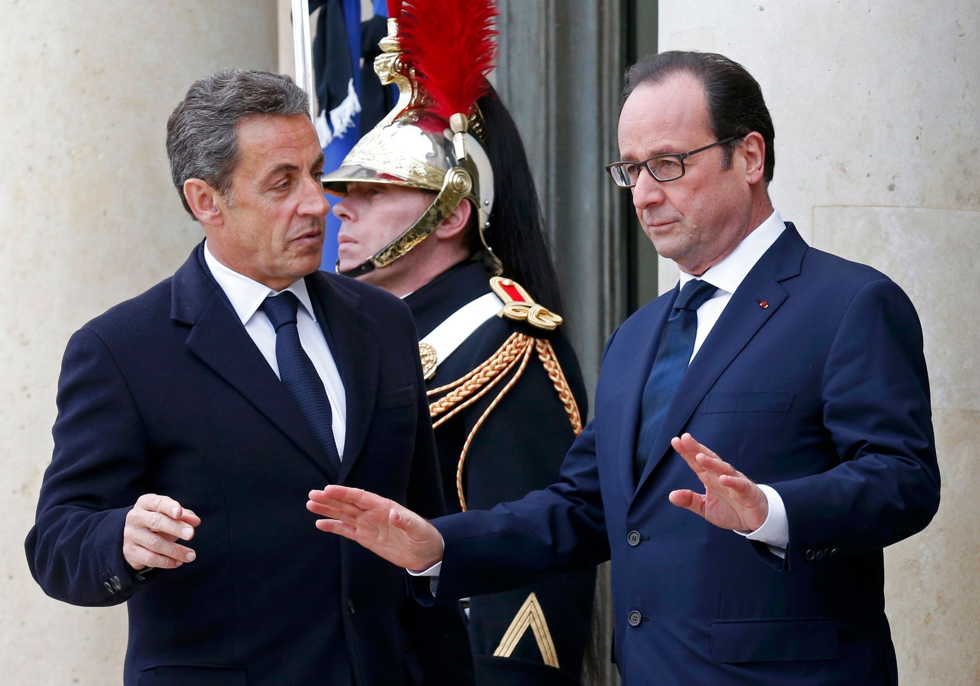 French President Francois Hollande welcomes former French President Nicolas Sarkozy, head of the French conservative party UMP party, at the Elysee Palace before attending a solidarity march in the st