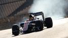 Tyres smoke as Manor Racing Formula One driver Rio Haryanto of Indonesia takes a curve with his car during the third testing session ahead of the upcoming season at the