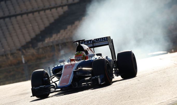 Tyres smoke as Manor Racing Formula One driver Rio Haryanto of Indonesia takes a curve with his car during the third testing session ahead of the upcoming season at the