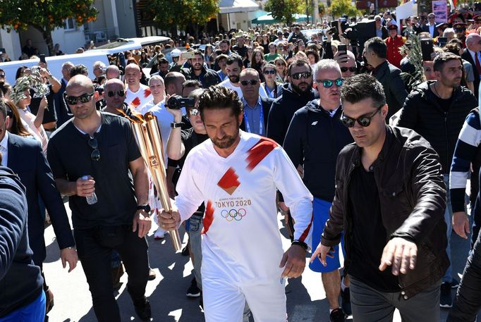 Olympics - Torch relay of the Olympic flame for Tokyo 2020 - Sparta, Greece - March 13, 2020 US actor Gerard Butler takes part in the Olympic flame torch relay for the To