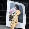 A photo of Prince is held up by a guitar leaning against First Avenue, the nightclub where U.S. music superstar Prince got his start in Minneapolis, Minnesota