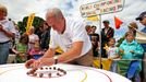 World Snail Racing Championships in Congham, Norfolk, Britain - 18 Jul 2010 2010-07-18 00:00:00 Mandatory Credit: Photo by Geoffrey Robinson / Rex Features ( 1208528b ) Snailmaster Neil Risborough lines up the snails World Snail Racing Championships in Congham, Norfolk, Britain - 18 Jul 2010 More than 200 snails slugged it out at the annual World Snail Racing Championships in a tiny Norfolk village this weekend. The garden snails spent Saturday afternoon sliming over a challenging 13 inch course to win a silver tankard stuffed with lettuce. The quirky competition, which has been running for nearly 40 years, is held in Congham, near King's Lynn in Norfolk and attracts thousands of spectators every year. Although there are a number of imitations, it is the only recognised World Championship. This year saw its oldest ever winner with a snail belonging to 62-year-old Claire Lawrence, from Litcham in Norfolk, coming first. Her snail, named Sidney, crossed the finishing line in 3.41 minutes. "I'm shell shocked my mum has won, as it's the first time she has entered," said her son Harry Lawrence, 21, from Litcham. "She selected Sidney a couple of days ago and she has been training him in our garden and feeding him on a diet of rocket salad." The championships are part of Congham fete and were originally started to help raise money for the 13th century village church. Today it attracts hundreds of entrants of all ages, many whom have spent days training their snails for the big event. "Congham is ideal snail breeding and racing country as they like damp conditions and the village sits in a low-lying area surrounded by ponds," said organiser Hilary Scase. "People love coming along because it is quirky and something different "A lot of the children like to choose their snails a long time in advance and train them. "Surprisngly the snails seem to respond to being talked to and small snails seem to do better as they have smaller shells so they can move mo... For more information visit http://www.rexfeatures.com/stacklink/EPKKVYUIW