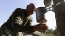 Villager Shamianok washes his face at house in abandoned village of Tulgovichi