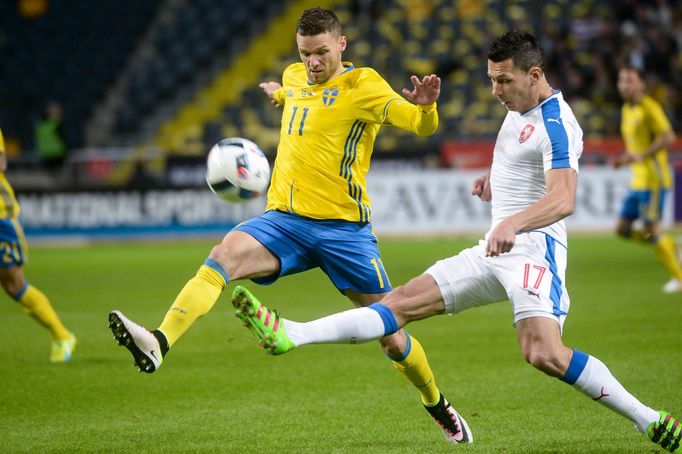 Sweden's Marcus Berg (L) fights for the ball with Czech Marek Suchy during the friendly soccer match between Sweden and the Czech Republic at the Friends Arena in Stockho