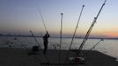 Jordi Salla Serra of Spain casts during the 14th Carpfishing World Championship in Corbu village, 310 km (192 miles) east of Bucharest, September 28, 2012. REUTERS/Radu Sigheti (ROMANIA - Tags: SOCIETY SPORT) Published: Zář. 28, 2012, 9:09 odp.