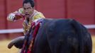 Colombian matador Luis Bolivar prepares to drive a sword into a bull during a bullfight in Seville