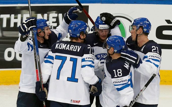 Finland's Petri Kontiola (C) celebrates his goal against Latvia with team mates Juuso Hietanen (L), Leo Komarov (2nd L), Tuukka Mantyla (2nd R) and Jori Lehtera (R) durin