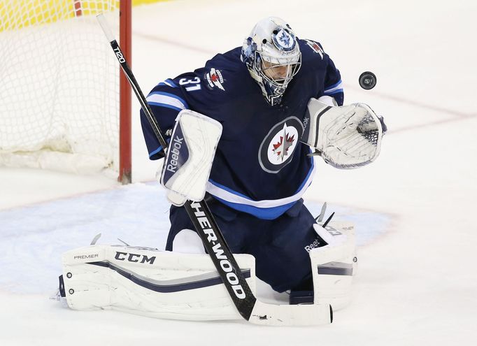 Winnipeg Jets goalie Ondrej Pavelec (31) makes a save during the second period against the Dallas Stars at MTS Centre. Mandatory