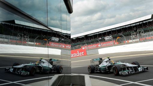 Mercedes Formula One driver Lewis Hamilton of Britain drives into the pit lane during final practice ahead of the British Grand Prix at the Silverstone Race circuit, cent