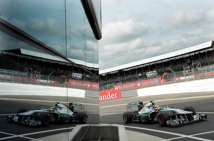 Mercedes Formula One driver Lewis Hamilton of Britain drives into the pit lane during final practice ahead of the British Grand Prix at the Silverstone Race circuit, cent