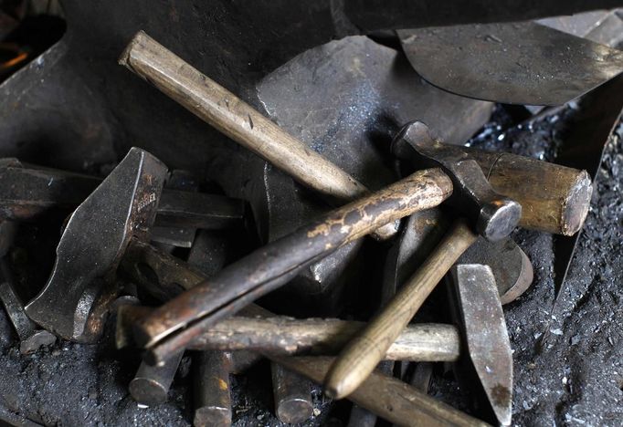 Hammers are pictured at a workshop in Molln, Upper Austria June 12, 2012. Blacksmith brothers Johann, 29, and Georg, 28, produce made-to-order handmade harnesses for the Vatican Swiss Guard, which take 120 hours of handiwork per piece and hardly differs from the 500-year-old originals. The brothers carry on the tradition of the blacksmith trade in the fifth generation of their family. REUTERS/Lisi Niesner (AUSTRIA - Tags: SOCIETY MILITARY) Published: Čer. 12, 2012, 10:14 odp.