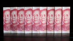 Čínské bankovky s Mao Ce-tungem.
