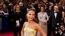 Alicia Vikander, nominated for Best Supporting Actress in &quot;The Danish Girl,&quot; wears a yellow Louis Vuitton gown as she arrives at the 88th Academy Awards in Holl