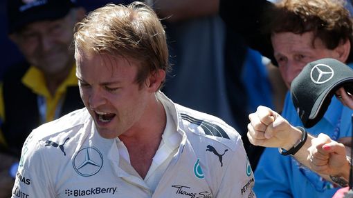 Mercedes Formula One driver Nico Rosberg of Germany reacts with teammates after taking the pole position during the qualifying session of the Monaco Grand Prix in Monaco