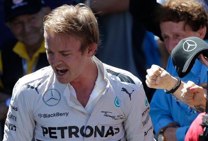 Mercedes Formula One driver Nico Rosberg of Germany reacts with teammates after taking the pole position during the qualifying session of the Monaco Grand Prix in Monaco