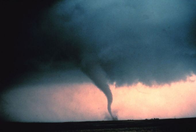 Tornado with dust and debris cloud forming at surface. During "Sound Chase", a joint project of NSSL and Mississippi State University. Oklahoma, Cordell. May 22, 1981. Credit: NOAA Photo Library, NOAA Central Library; OAR/ERL/National Severe Storms Laboratory (NSSL).