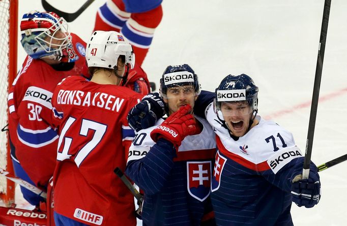 Slovakia's Tomas Tatar (2nd R) celebrates his goal against Norway with team mate Radoslav Tybor (R) during the first period of their men's ice hockey World Championship g