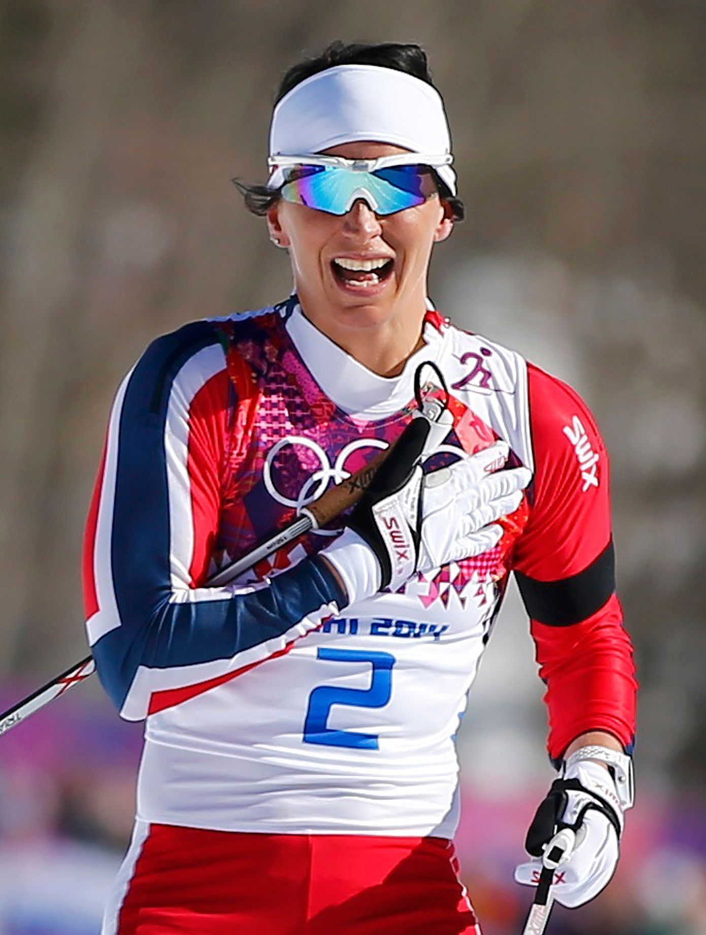 Norka Björgenová po vítězství ve skiatlonu na OH v Soči 2014