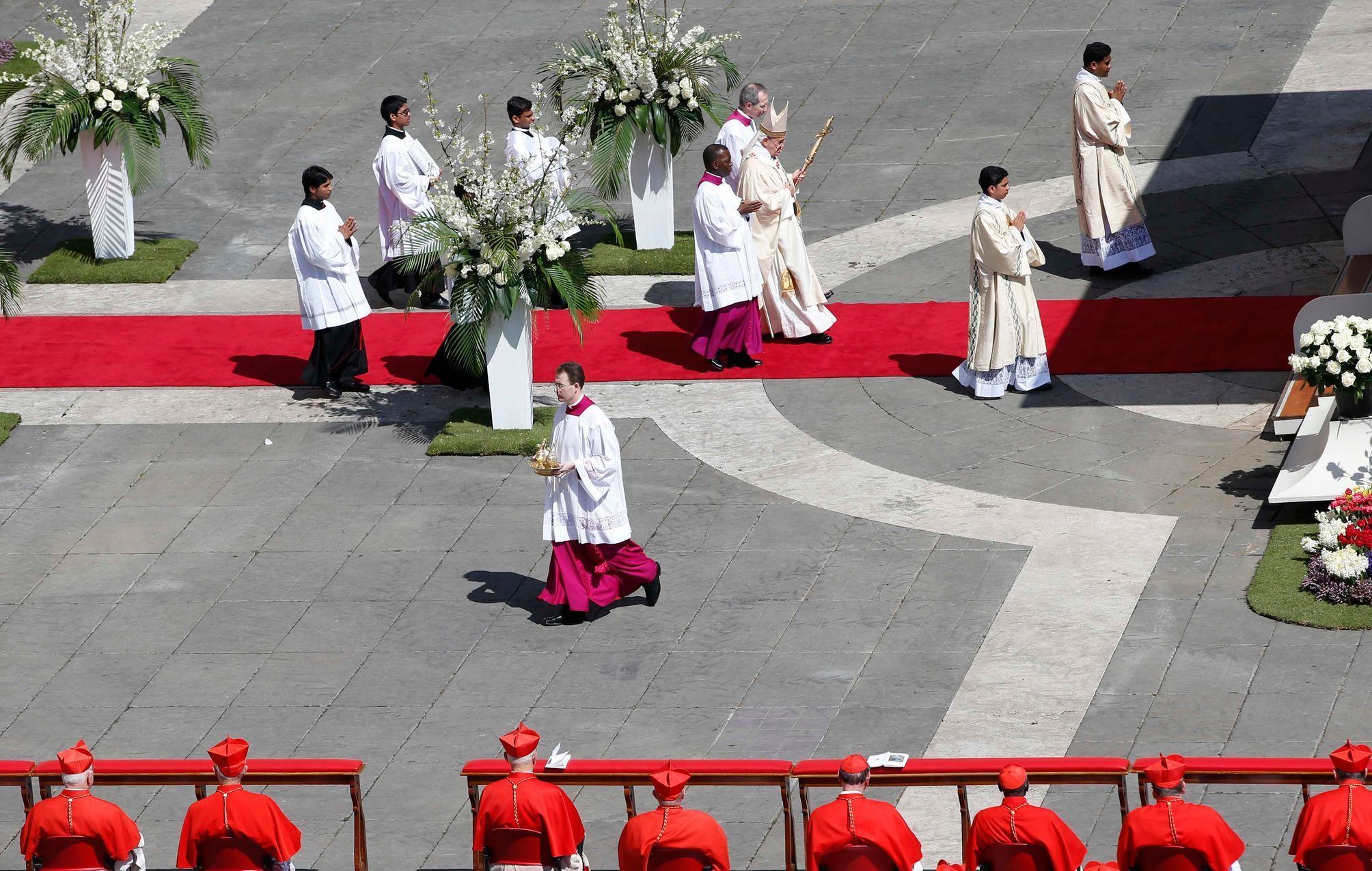 Pope Francis walks with his pastoral cross as he leads the Easter mass in Saint Peter's Square at the Vatican