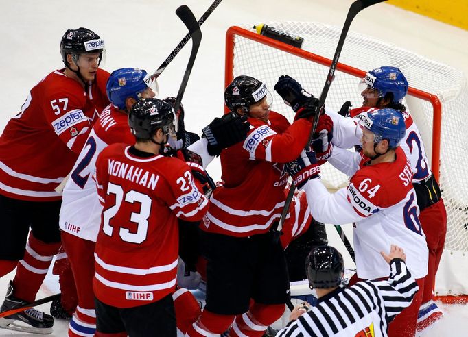 Players of the Czech Republic and Canada fight during the third period of their men's ice hockey World Championship group A game against Canada at Chizhovka Arena in Mins