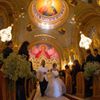 Moshar, who is of Persian, German and Filipino descent, walks down the aisle with her new husband Safar, whose parents are from Syria, at their wedding in Saint Sophia Greek Orthodox Cathedral in Los