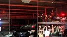 The glass door and some cars which were vandalized are seen in a vehicle store during a protest against 2014 World Cup in Sao Paulo May 15, 2014. Brazilians opposed to th