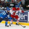 Finland's Immonen and Jordan of the Czech Republic chase the puck during their men's ice hockey World Championship semi-final game at Minsk Arena in Minsk