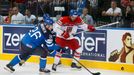 Finland's Jarkko Immonen (L) and Michal Jordan of the Czech Republic chase the puck during their men's ice hockey World Championship semi-final game at Minsk Arena in Min