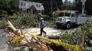 USA-WEATHER-STORM/ Description: An electrical worker walks down a street where a fallen tree had cut overhead power lines, during emergency repairs in Wheaton, Maryland, July 2, 2012. Blistering heat blanketed much of the eastern U.S. for the fourth straight day on Monday, after violent storms that took at least 15 lives and knocked out power to more than 3 million customers. REUTERS/Jason Reed (UNITED STATES - Tags: ENERGY ENVIRONMENT) Published: Čec. 2, 2012, 6:07 odp.