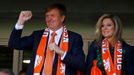 King Willem-Alexander and Queen Maxima of the Netherlands cheer as they watch their 2014 World Cup Group B soccer match against Australia at the Beira Rio stadium in Port